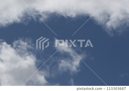 Cloudscape scenery, overcast weather above dark blue sky. Storm clouds floating in a rainy dull day with natural light. White and grey scenic environment background. Nature view. 113303687