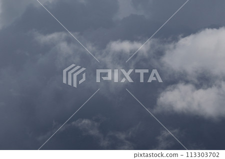 Cloudscape scenery, overcast weather above dark blue sky. Storm clouds floating in a rainy dull day with natural light. White and grey scenic environment background. Nature view. Cloudscape scenery, overcast weather above dark blue sky. Storm clouds floating in a rainy dull day with natural light. White and grey scenic environment background. Nature view. 113303702