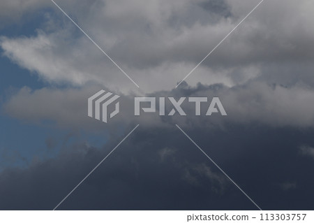 Cloudscape scenery, overcast weather above dark blue sky. Storm clouds floating in a rainy dull day with natural light. White and grey scenic environment background. Nature view. Cloudscape scenery, overcast weather above dark blue sky. Storm clouds floating in a rainy dull day with natural light. White and grey scenic environment background. Nature view. 113303757