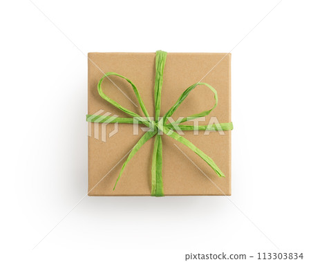 Top view of craft cardboard gift box with green recycled paper ribbon isolated on white 113303834