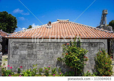 Okinawa Prefecture, Taketomi Island: Ryukyu red tile house with Himpun (stone wall) 113304003
