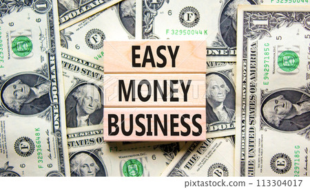Easy money business symbol. Concept words Easy money business on beautiful wooden blocks. Dollar bills. Beautiful dollar bills background. Easy money business concept. Copy space. 113304017