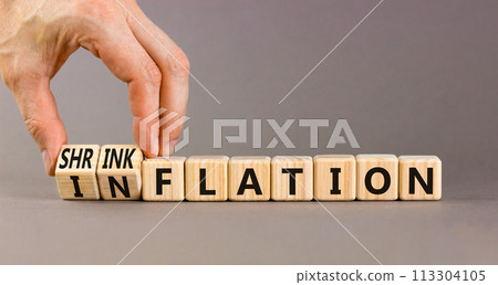 Inflation or shrinkflation symbol. Concept words Inflation Shrinkflation on beautiful wooden blocks. Beautiful grey background. Businessman hand. Business inflation shrinkflation concept. Copy space Inflation or shrinkflation symbol. Concept words Inflation Shrinkflation on beautiful wooden blocks. Beautiful grey background. Businessman hand. Business inflation shrinkflation concept. Copy space 113304105