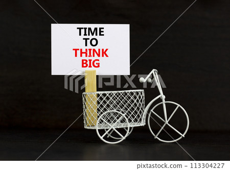 Time to think big symbol. Concept words Time to think big on beautiful white paper on clothespin. Bicycle model. Beautiful black background. Business and time to think big concept. Copy space. 113304227