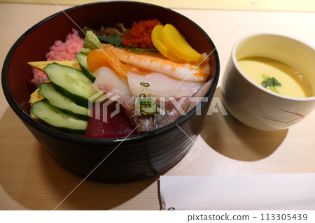 Colorful Japanese chirashi sushi and chawanmushi served at home on a celebratory occasion 113305439