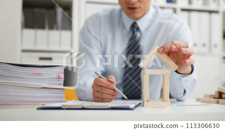 Male hand holds the roof to the lock in Male hand holds the roof to the lock in 113306630