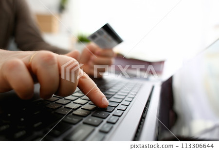 Male arms hold credit card press buttons making transfer 113306644