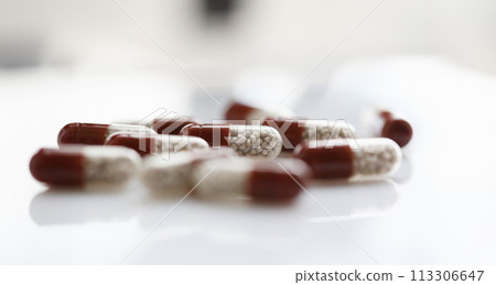 Tablets scattered on the table of the 113306647