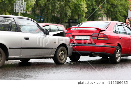 Accident of red and silver car after rain Accident of red and silver car after rain 113306685