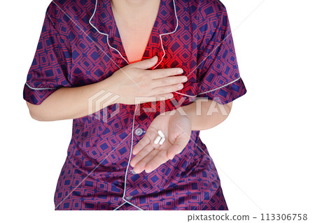 Woman holding one hand on her chest In the other hand was a pill. is having a heart attack isolated on a white background 113306758