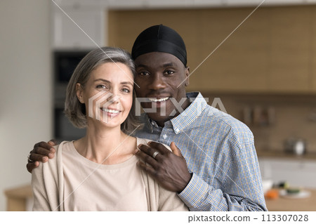 Portrait of mature multiethnic spouses looking at camera 113307028