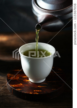 Strong, deep-steamed green tea served in a teapot Strong, deep-steamed green tea served in a teapot 113307038