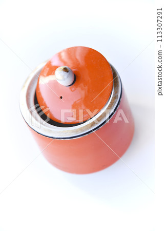 Red ceramic sugar bowl on a white background. Sugar in a jar. Red ceramic sugar bowl on a white background. Sugar in a jar. 113307291