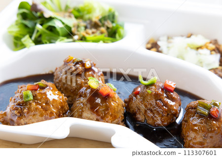 Delicious black vinegar meatballs for takeout Delicious black vinegar meatballs for takeout 113307601