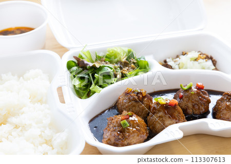 Delicious black vinegar meatballs in a Chinese bento Delicious black vinegar meatballs in a Chinese bento 113307613