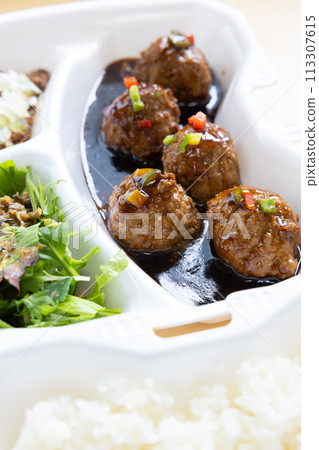 Delicious black vinegar meatballs in a Chinese bento 113307615