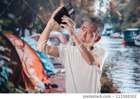 Homeless man living on the street 113308302