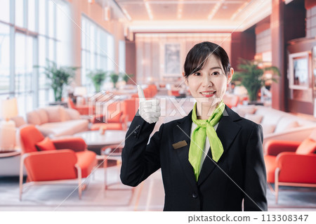 Female staff serving customers at a hotel Female staff serving customers at a hotel 113308347