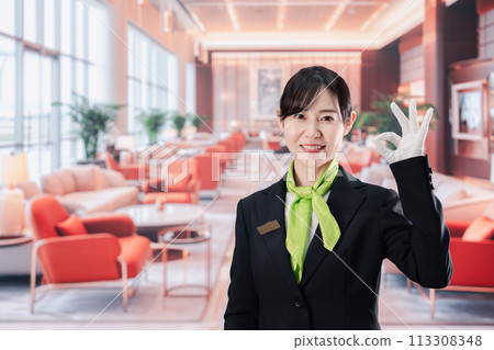 Female staff serving customers at a hotel Female staff serving customers at a hotel 113308348