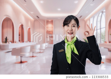 Young woman serving customers at a salon 113308533