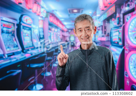Senior man at a pachinko parlor 113308602