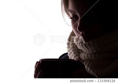 Silhouette of a young woman with a cup Silhouette of a young woman with a cup 113309116