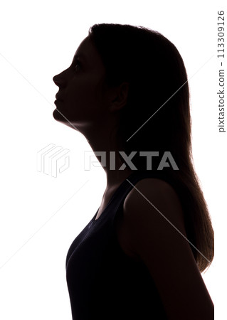 Young woman looking up - vertical silhouette 113309126