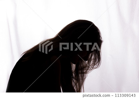 Silhouette of a young woman with problems 113309143