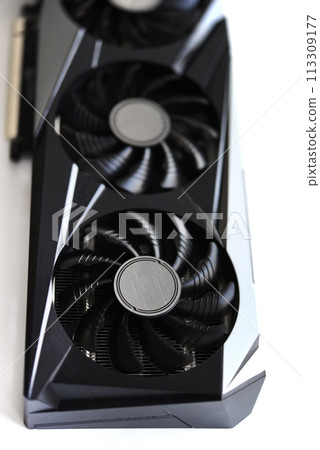 A black and white video card on a white background. Fans and the graphics card case. Computer accessories. 113309177