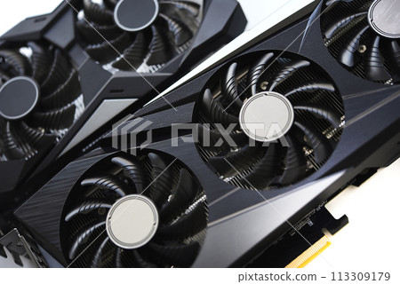 A black and white video card on a white background. Fans and the graphics card case. Computer accessories. 113309179