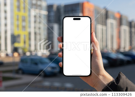 Berlin Germany January 21 2024 Holding iphone mockup, mobile phone screen, blank smartphone display Berlin Germany January 21 2024 Holding iphone mockup, mobile phone screen, blank smartphone display 113309426