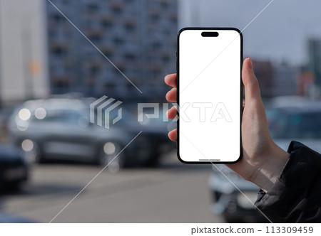 Berlin Germany January 21 2024 Hand holding mobile phone screen mock up, iphone mockup Berlin Germany January 21 2024 Hand holding mobile phone screen mock up, iphone mockup 113309459