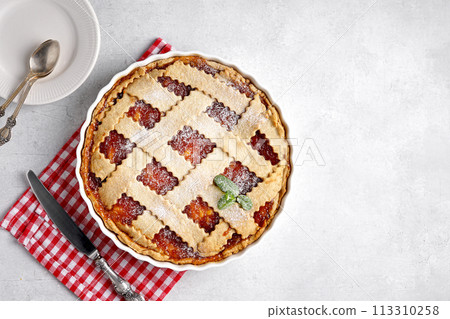 Homemade apple pie with apple jam on red napkin Homemade apple pie with apple jam on red napkin 113310258