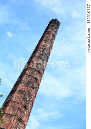 Smokestack of an old abandoned industrial Smokestack of an old abandoned industrial 113310317