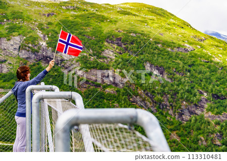 Tourist on Utsikten viewpoint, Norway Tourist on Utsikten viewpoint, Norway 113310481