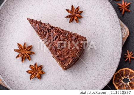 Delicious fresh cheesecake cake or snickers with cream and nuts on a ceramic plate Delicious fresh cheesecake cake or snickers with cream and nuts on a ceramic plate 113310827