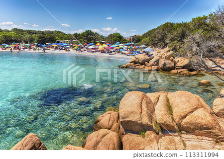 The scenic Capriccioli beach in Costa Smeralda, Sardinia, Italy The scenic Capriccioli beach in Costa Smeralda, Sardinia, Italy 113311994