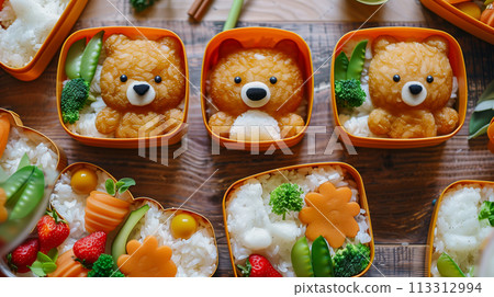It's the centerpiece of a bento lunch surrounded by traditional Japanese cuisine in a warm, ambient light. It's the centerpiece of a bento lunch surrounded by traditional Japanese cuisine in a warm, ambient light. 113312994