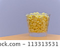 Yellow supplement in a bottle 113313531