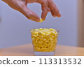 Women's hand with supplements 113313532