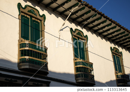 Beautiful facade of the houses at the historical downtown of the heritage town of Salamina located at the Caldas department in Colombia. 113313645