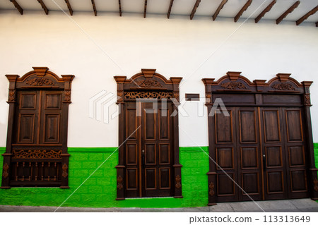 Beautiful facade of the houses at the historical downtown of the heritage town of Salamina located at the Caldas department in Colombia. Beautiful facade of the houses at the historical downtown of the heritage town of Salamina located at the Caldas department in Colombia. 113313649