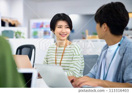 Young female engineer working in the office 113316403