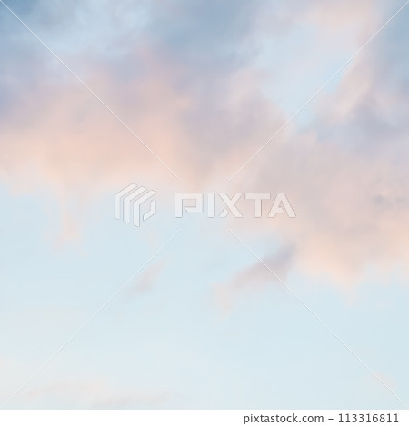 Background of blue sky with pale pink clouds at sunset Background of blue sky with pale pink clouds at sunset 113316811