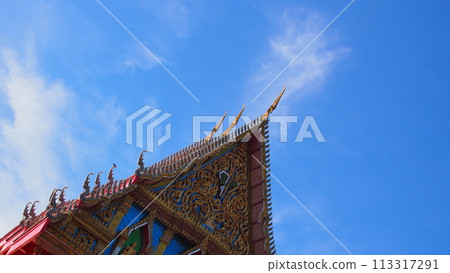 Blue sky and white clouds with sun beam over the buddhist temple roof in Thailand. Picture for use in Background image or copy space Blue sky and white clouds with sun beam over the buddhist temple roof in Thailand. Picture for use in Background image or copy space 113317291
