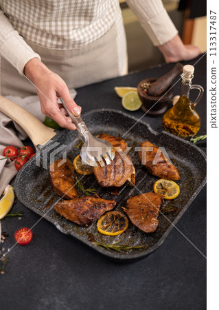 grilled pieces of Organic Tuna Steak on a grill frying pan 113317487