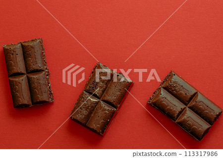 Chocolate bar pieces. Background with chocolate. Sweet food photo concept. 113317986