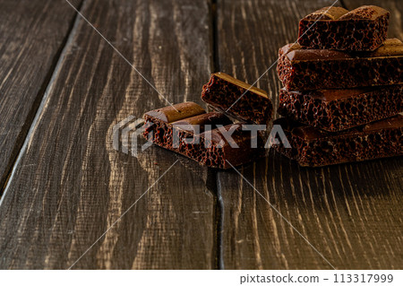 Chocolate bar pieces. Background with chocolate. Sweet food photo concept. Chocolate bar pieces. Background with chocolate. Sweet food photo concept. 113317999
