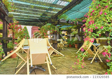 Closed cafe terrace in a small European city 113320385