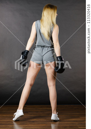 Boxer girl exercise with boxing gloves. Boxer girl exercise with boxing gloves. 113320416